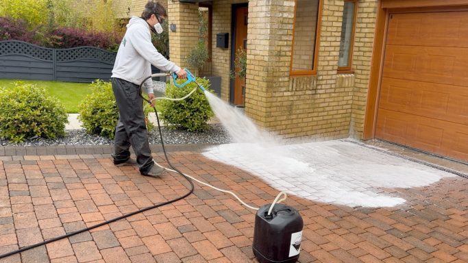 Chemical Driveway Cleaning Cardiff Chemical cleaning treatment being applied to a block paving driveway in Cardiff